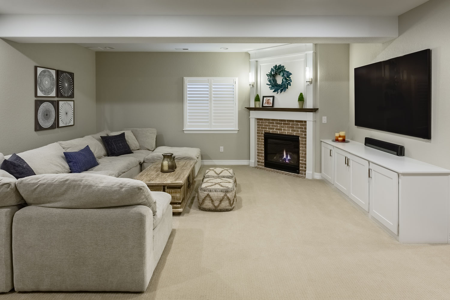 Basement rec room with corner fireplace